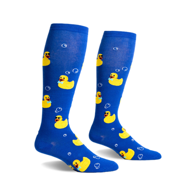 Pair of blue knee-high socks with yellow rubber duckies wearing sunglasses and bow ties, and white bubbles printed on them.