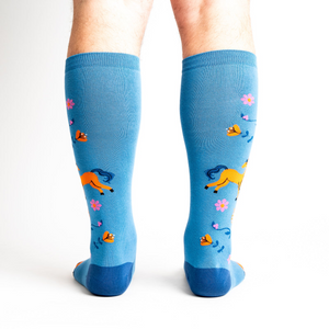Rear view of model wearing the 'Hay There' socks, showcasing the design from behind.