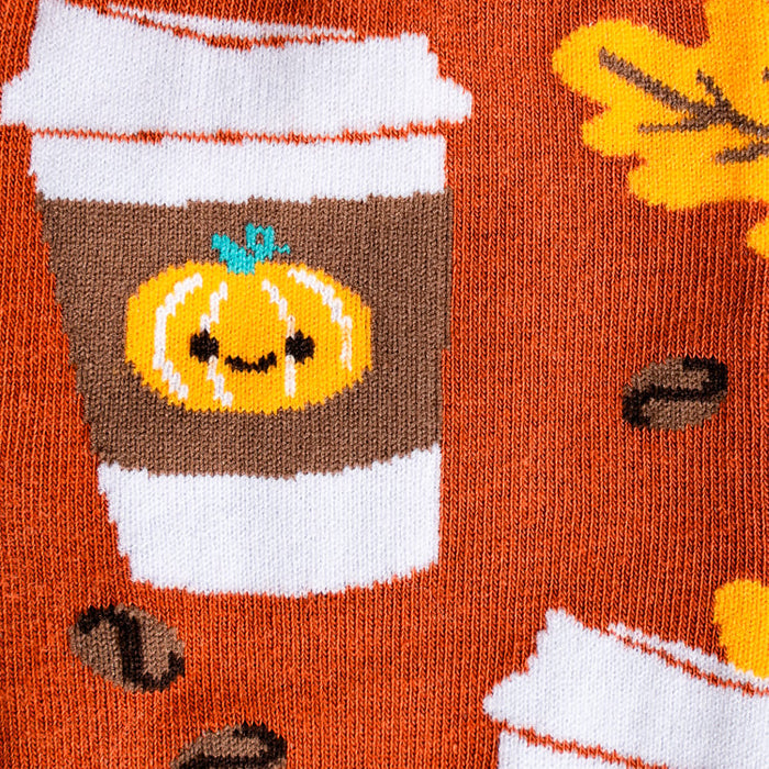 Close-up detail shot of the PSL socks' pattern, showcasing the cute pumpkin spice latte design.