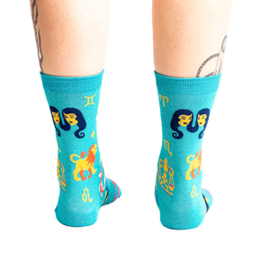 Back view of the teal zodiac socks, showcasing the design's full coverage.