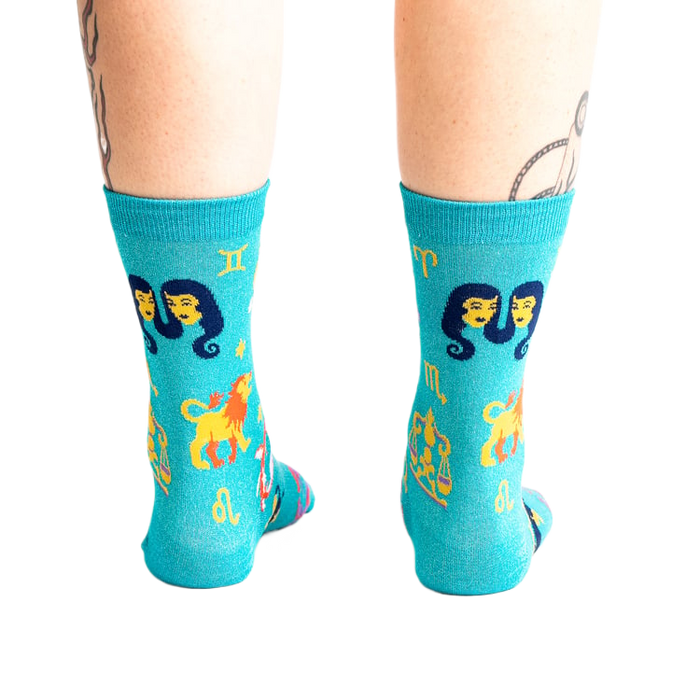 Back view of the teal zodiac socks, showcasing the design's full coverage.