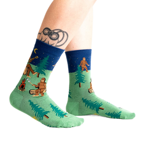 Lifestyle shot of Sasquatch Campout socks on a person's legs.