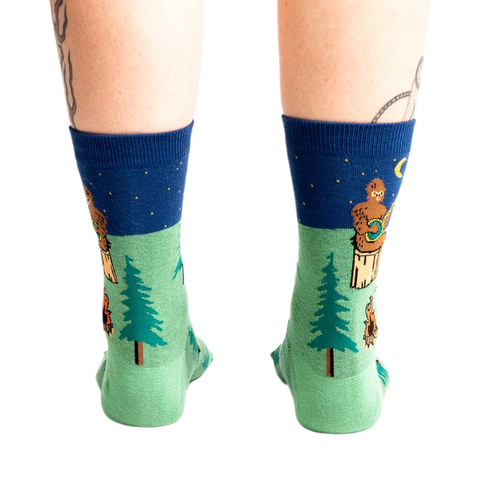 Rear view of the Sasquatch Campout socks on a model's legs.