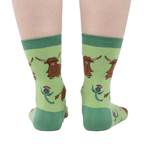 Rear view of the socks on a person's feet, giving a full view of the pattern.