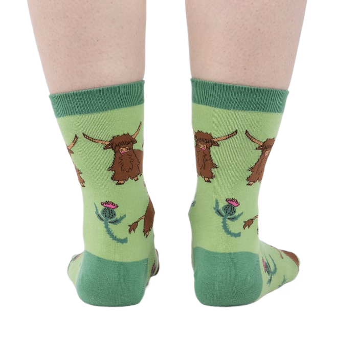 Rear view of the socks on a person's feet, giving a full view of the pattern.