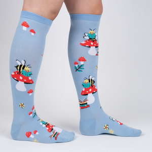 Lifestyle shot showing the socks on a person's legs, showcasing the fit and overall design.