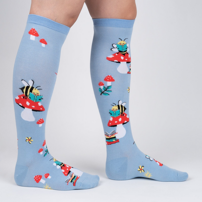 Lifestyle shot showing the socks on a person's legs, showcasing the fit and overall design.