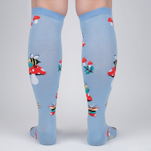 Rear view of the socks on a person's legs, highlighting the back pattern and design.