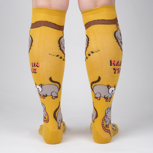 Rear view of mustard yellow knee-high socks showcasing the full possum pattern.