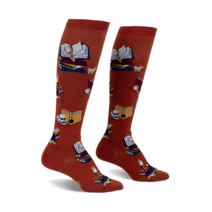 Pair of burnt orange knee-high socks featuring a repeating pattern of books, magnifying glasses, and skulls.