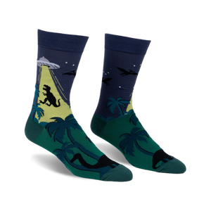 Crew socks in dark blue, green, and yellow. The design features a T-Rex, UFO, palm trees, and pterodactyls.