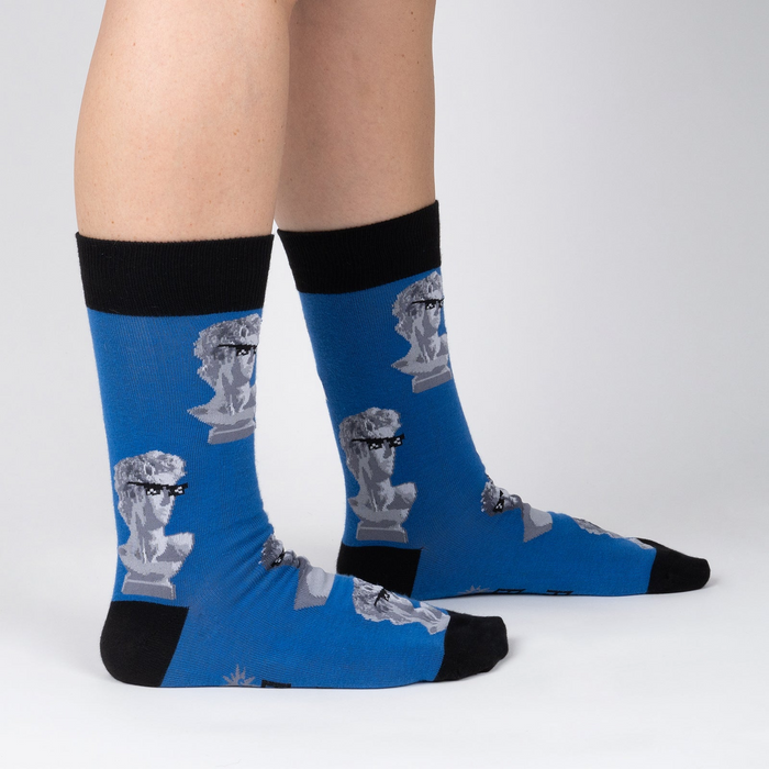 Lifestyle shot of a person's legs wearing the Roman Empire socks. Shows how the socks look when worn.