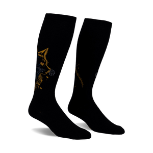 Pair of black knee-high socks with a gold and blue cat design. The cat's face is prominently featured on each sock.