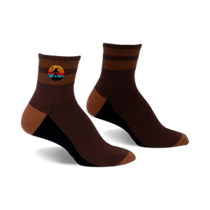 Pair of brown and tan striped ankle socks with a small embroidered Bigfoot in a retro sunset design.