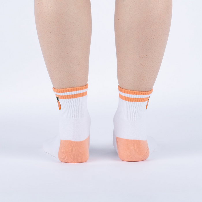 Rear view of the socks on a person's feet against a white background.