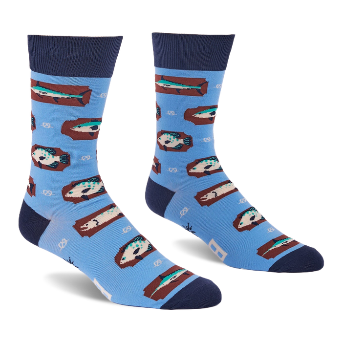 Pair of light blue crew socks with a repeating pattern of fish on brown rectangular shapes and white knot designs.