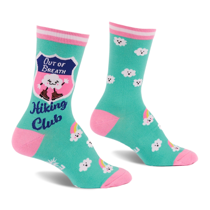 Pair of teal crew socks with pink toes, heels, and striped cuffs. Features a cloud in hiking boots, smiling white clouds, and rainbows.