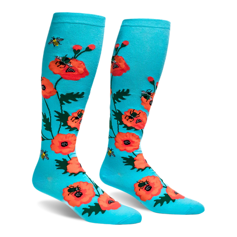 Bright turquoise knee-high socks featuring a pattern of large orange-red poppy flowers and flying yellow bumblebees.