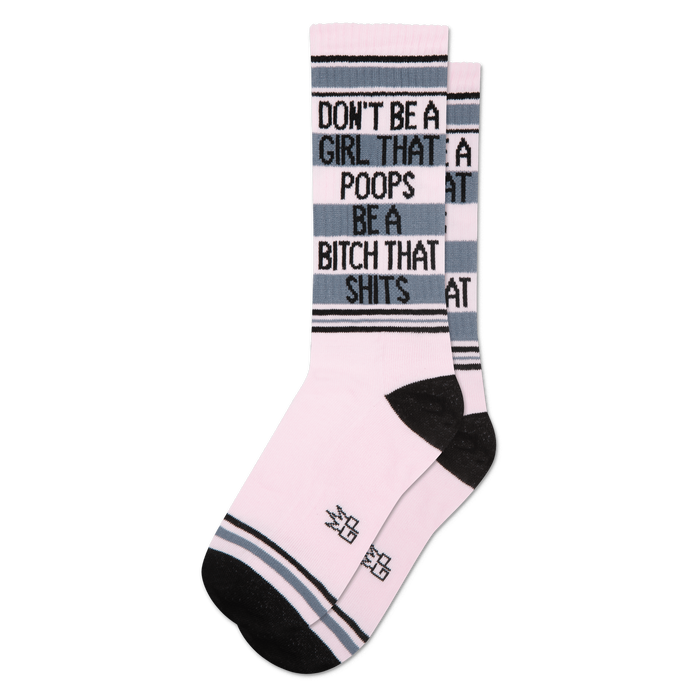 Pink crew socks with black and grey stripes, featuring text 'Don't Be A Girl That Poops Be A Bitch That Shits' on cuff.