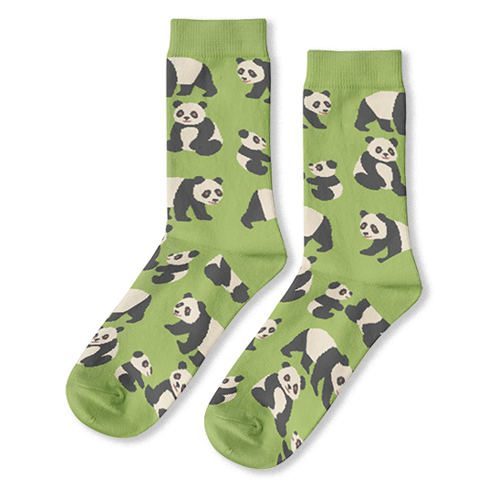 Light green crew socks covered in a scattered pattern of black and white giant pandas sitting, standing, and walking.