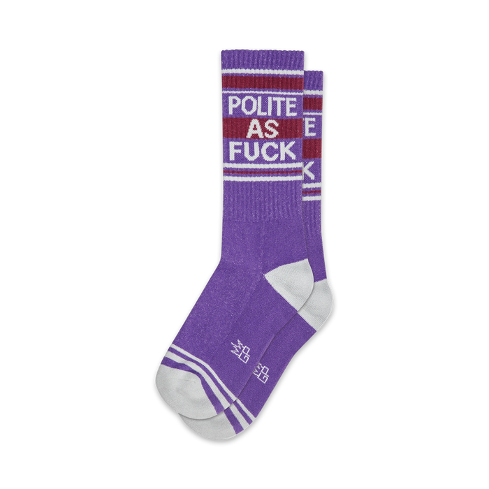 Pair of purple crew socks with white stripes and 'Polite As Fuck' text.  Retro-style font and design.