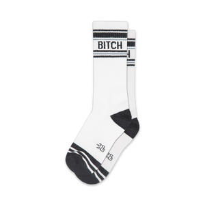 Pair of white crew socks with black stripes and the word 'BITCH' in black.