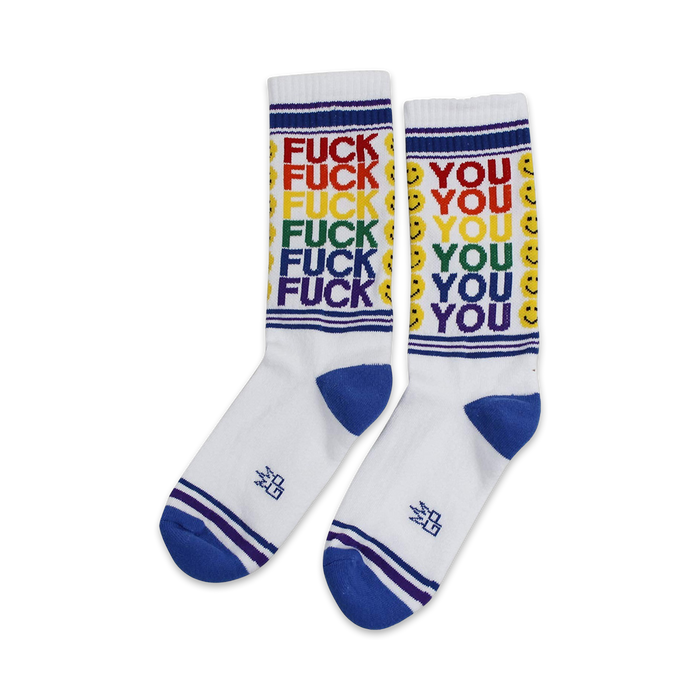 Pair of white crew socks with rainbow 'FUCK YOU' text and smiley faces. Blue and purple stripes at the cuff.