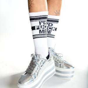 Lifestyle shot: Person wearing white 'I'd Fuck Me' socks, sitting with legs apart.
