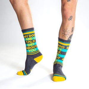 Lifestyle shot:  Person wearing 'My Dog and I Talk Shit About You' socks, showcasing the fit and design.