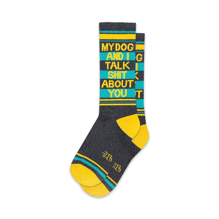 Pair of crew socks in gray, teal, and yellow. Features bold text: 'My Dog and I Talk Shit About You'.
