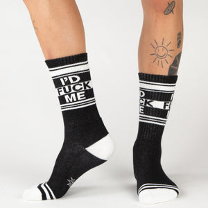 Lifestyle shot: Person wearing black 'I'd Fuck Me' socks with black shoes.