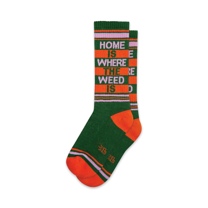 Pair of crew socks in green, orange, and purple.  Features a retro-style stripe pattern and the text 'Home Is Where The Weed Is'.