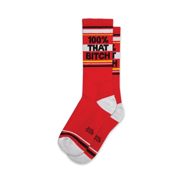 Pair of red crew socks with a white and black '100% THAT BITCH' band.  Features grey and black accents at the cuffs.