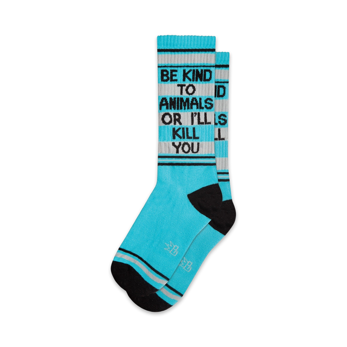 Pair of teal crew socks with black accents and the text 'Be Kind To Animals Or I'll Kill You'.