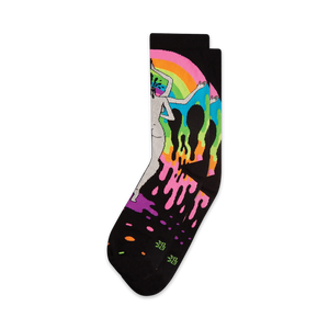 A pair of black crew socks featuring a vibrant rainbow design, a melting figure, and dripping paint splatters.