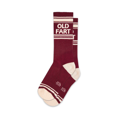Pair of maroon crew socks with off-white stripes and 'OLD FART' text. Retro design.