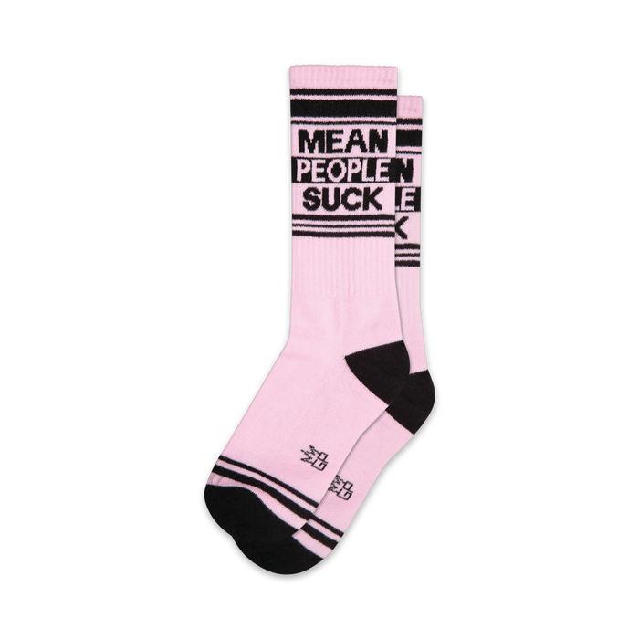 Pair of pink crew socks with black stripes and the phrase 'Mean People Suck' in black lettering.
