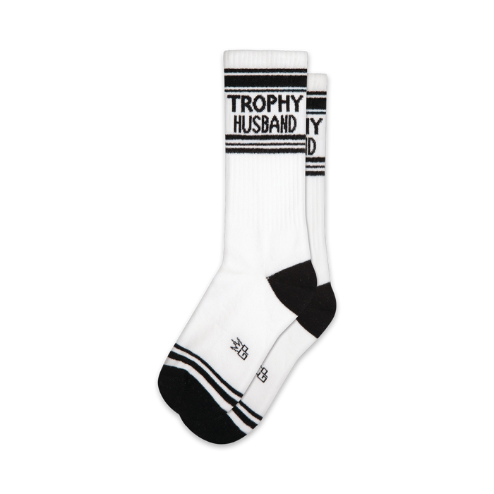 Pair of white crew socks with black stripes and 'Trophy Husband' text.