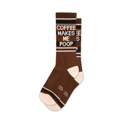 Pair of brown crew socks with a white and black "Coffee Makes Me Poop" graphic. Features stripes at the top and bottom.