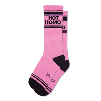 A pair of pink crew socks with black stripes and 'Hot Homo' in black lettering.  The socks have a dark charcoal heel and toe.