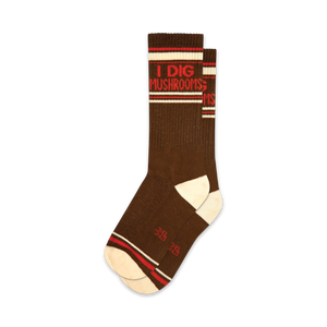 Pair of brown crew socks with red and white stripes and the text 'I Dig Mushrooms'.