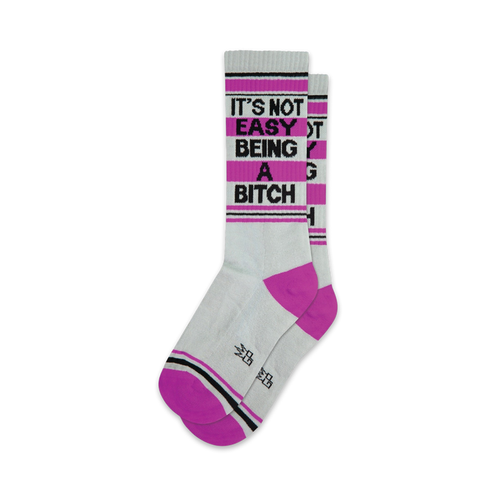 Pair of grey crew socks with hot pink cuffs and heel.  Black text reads 'It's Not Easy Being a Bitch'. }}