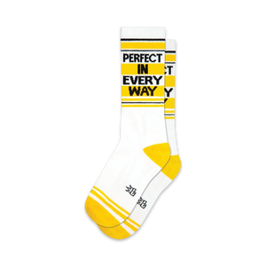 Pair of white crew socks with yellow stripes and the text 'PERFECT IN EVERY WAY' in black.