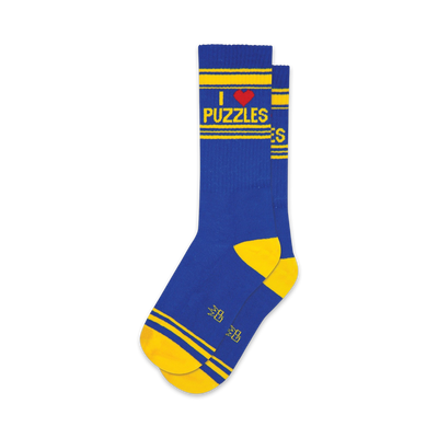 Pair of blue and yellow crew socks. Features 'I Love Puzzles' text and yellow stripes.
