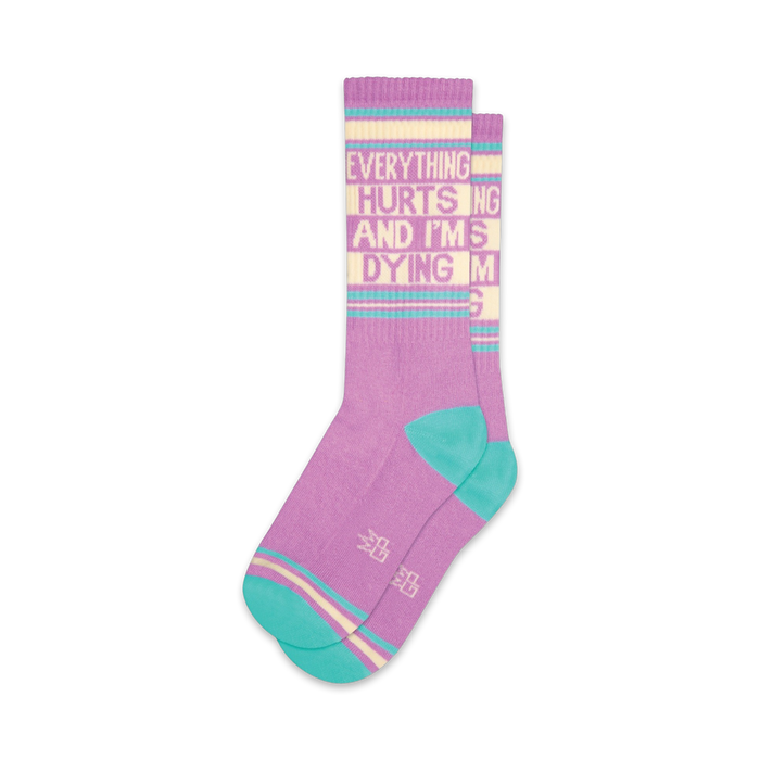 Pair of crew socks in purple and teal with the same text as the black pair.