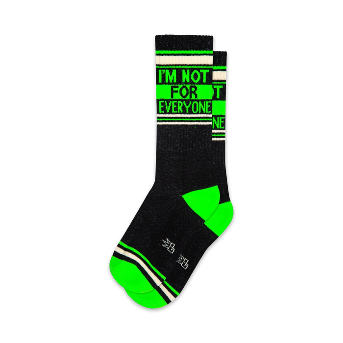 these black and green crew socks for men and women feature the text, 