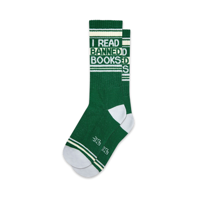 Pair of green crew socks with white stripes and the text 'I READ BANNED BOOKS'.