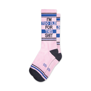 Pair of pink crew socks with navy blue and black stripes.  The socks feature the text 'I'm Too Old For This Shit' in a bold font.