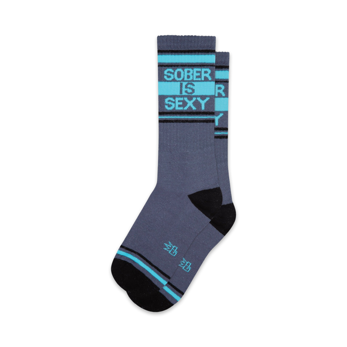 A pair of grey crew socks with teal and black stripes, displaying the text 'SOBER IS SEXY' in teal. }}