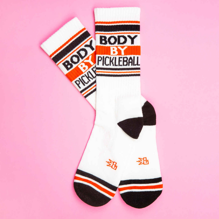 A white sock with orange and black stripes and the words 